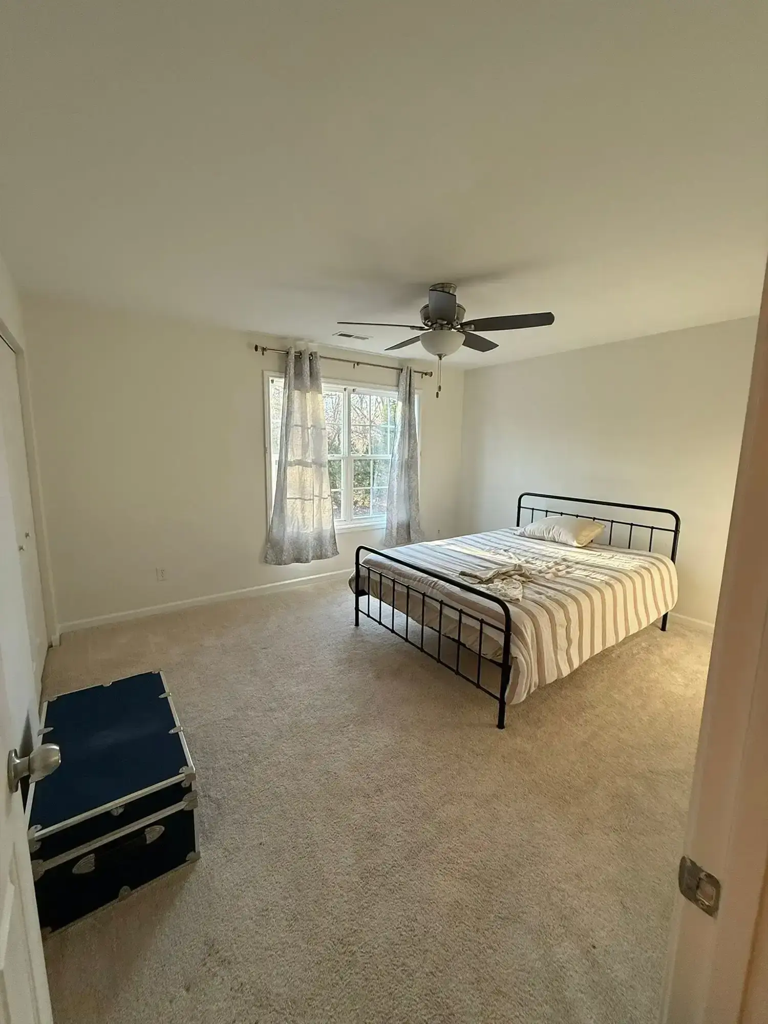 Bedroom refreshed with soft neutral wall and ceiling paint